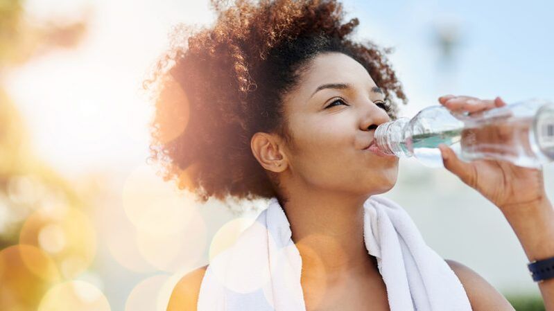 a girl drinks water on a diet